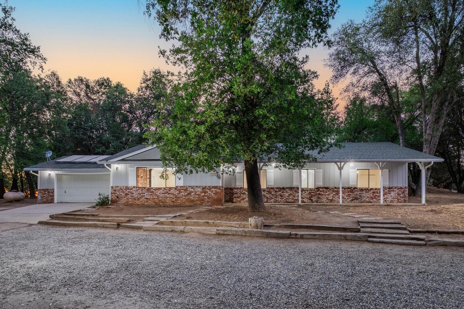 a front view of a house with yard