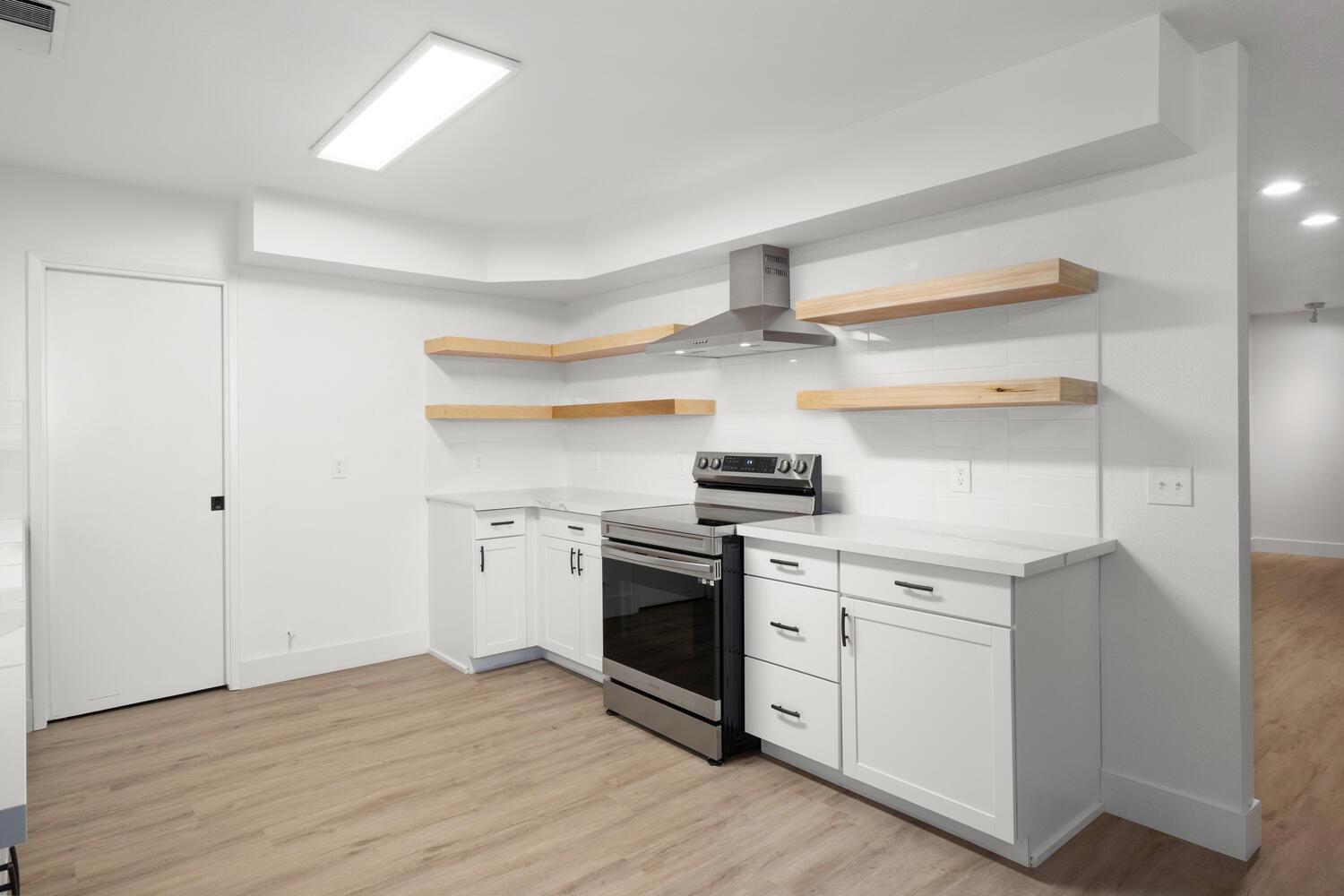 51202 Rusty Lane Oakhurst, CA 93644 - Photo 12 of 27 a kitchen with stainless steel appliances granite countertop a stove and a refrigerator