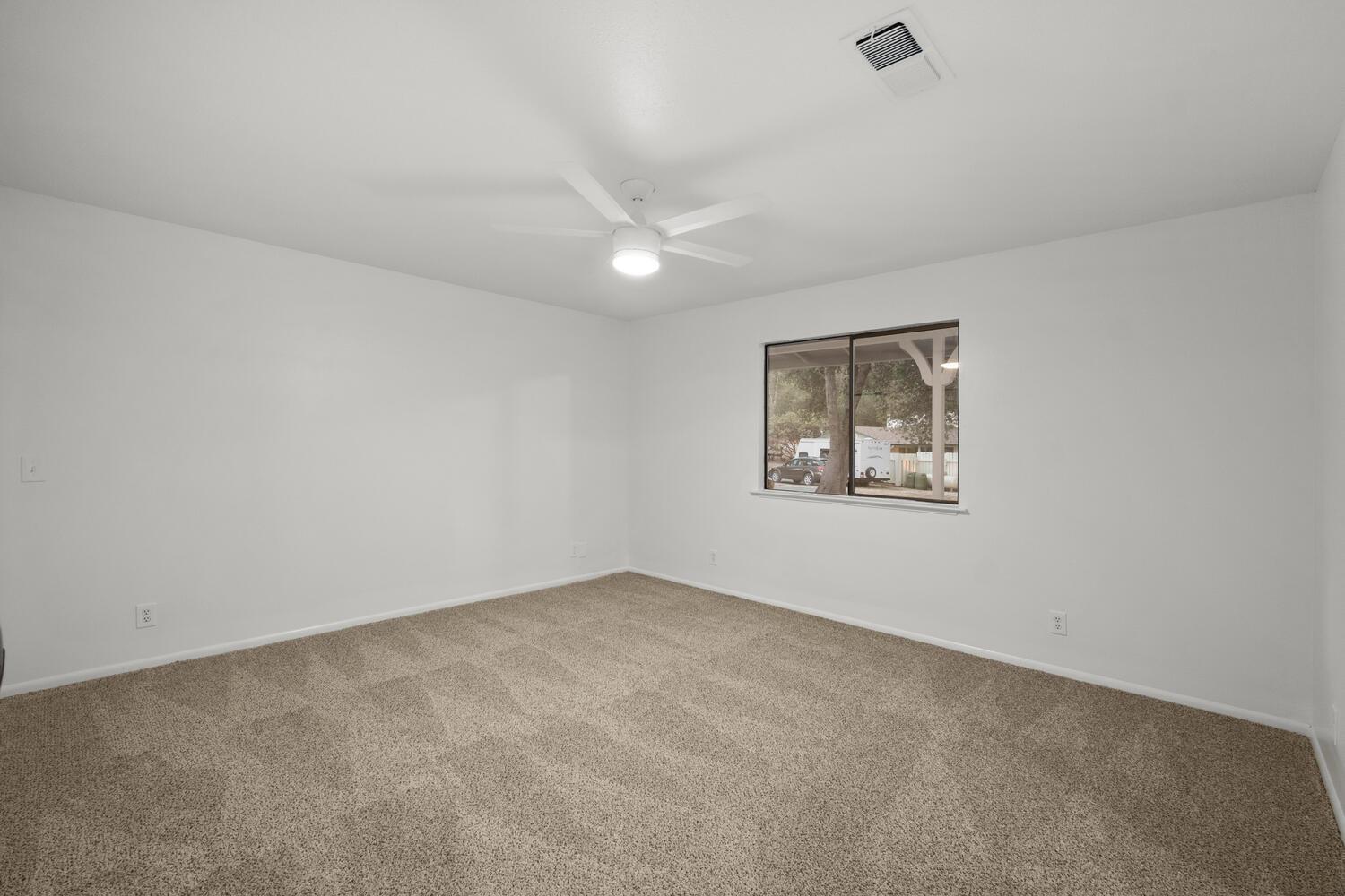 51202 Rusty Lane Oakhurst, CA 93644 - Photo 14 of 27 an empty room with windows