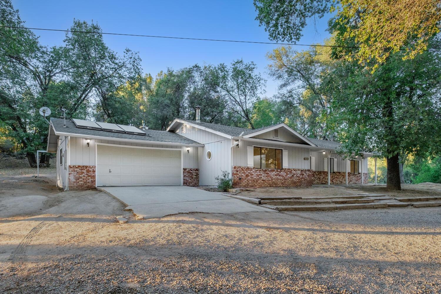 51202 Rusty Lane Oakhurst, CA 93644 - Photo 3 of 27 a house view with a outdoor space