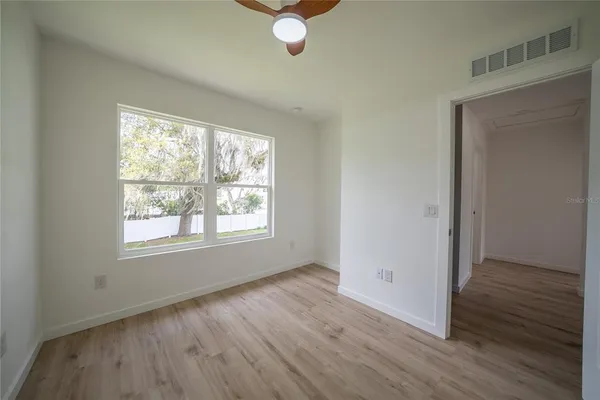 a view of room that has a white walls