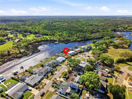 an aerial view of a houses with a yard