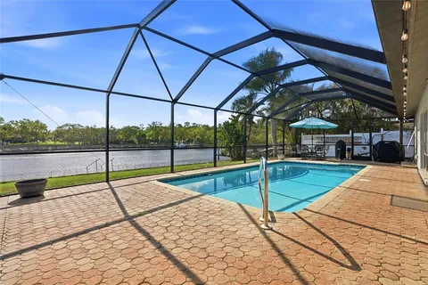 a view of pool with sitting area