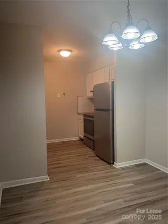 a view of a livingroom with wooden floor