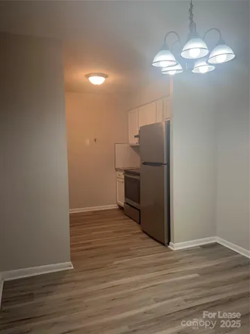 a view of a livingroom with wooden floor