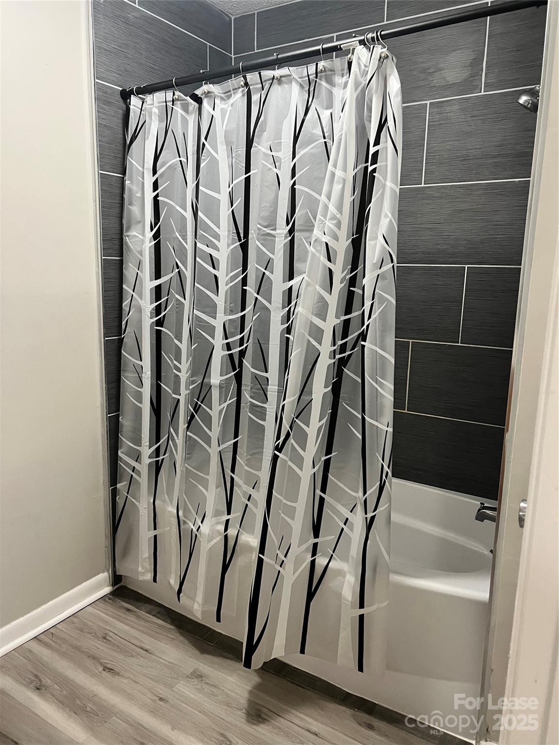 3215 Heathstead Place Charlotte, NC 28210 - Photo 7 of 10 a bathroom with a bathtub and shower