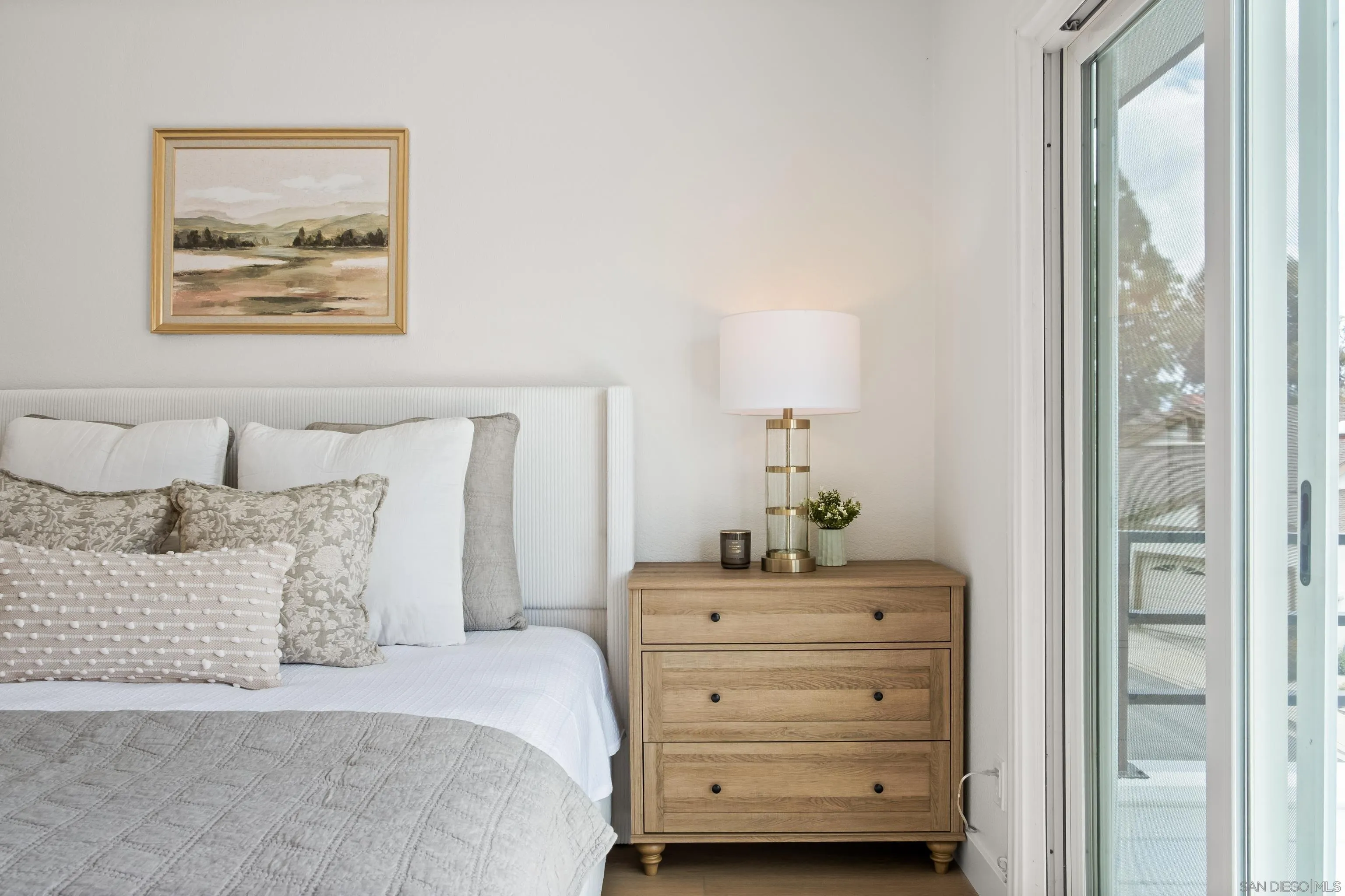 11478 Madera Rosa Way San Diego, CA 92124 - Photo 32 of 54 a bedroom with a bed and a painting on the wall