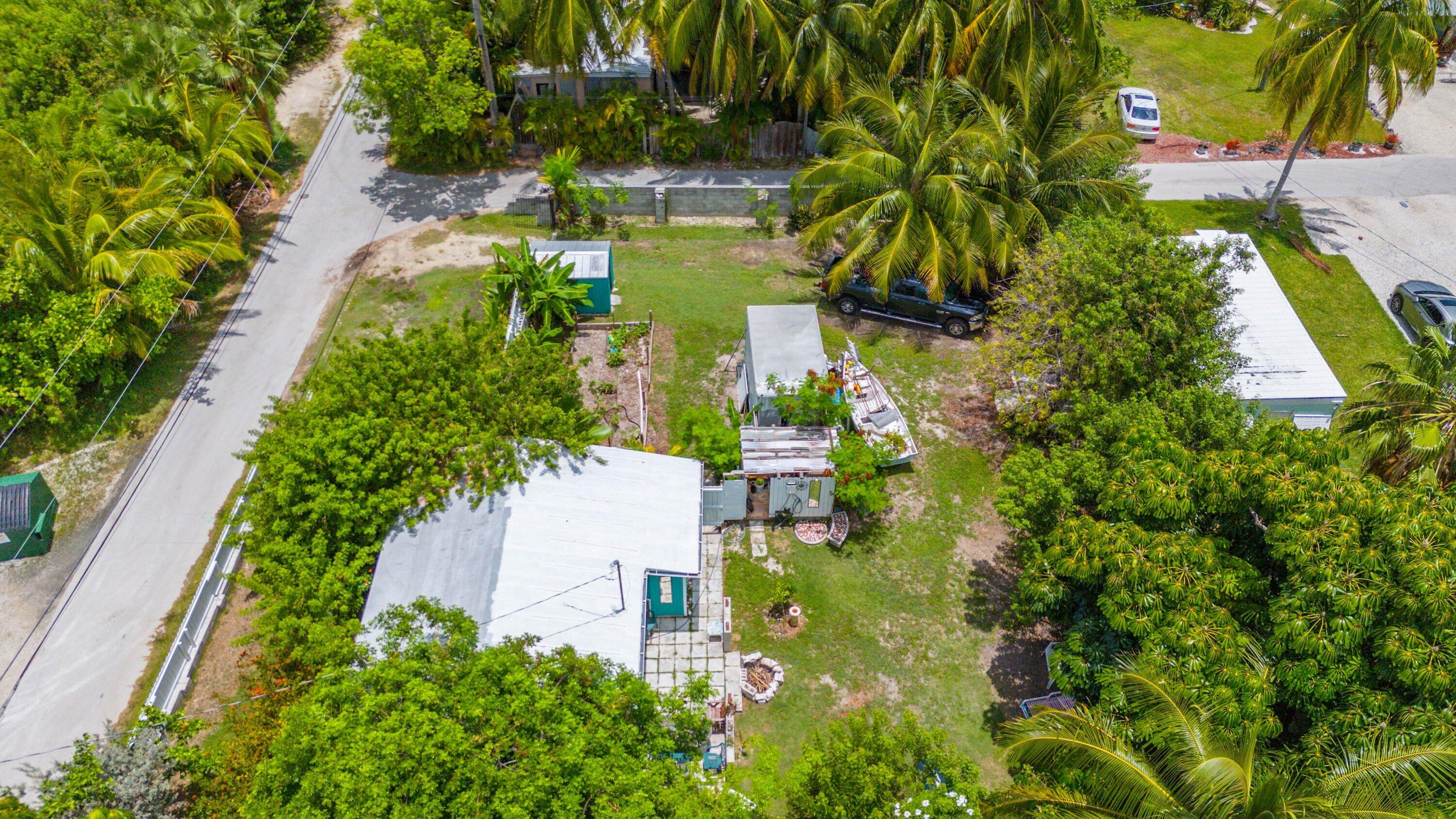 19910 Flamingo Road Sugarloaf, FL 33042 - Photo 21 of 26 an aerial view of residential house with outdoor space and trees all around