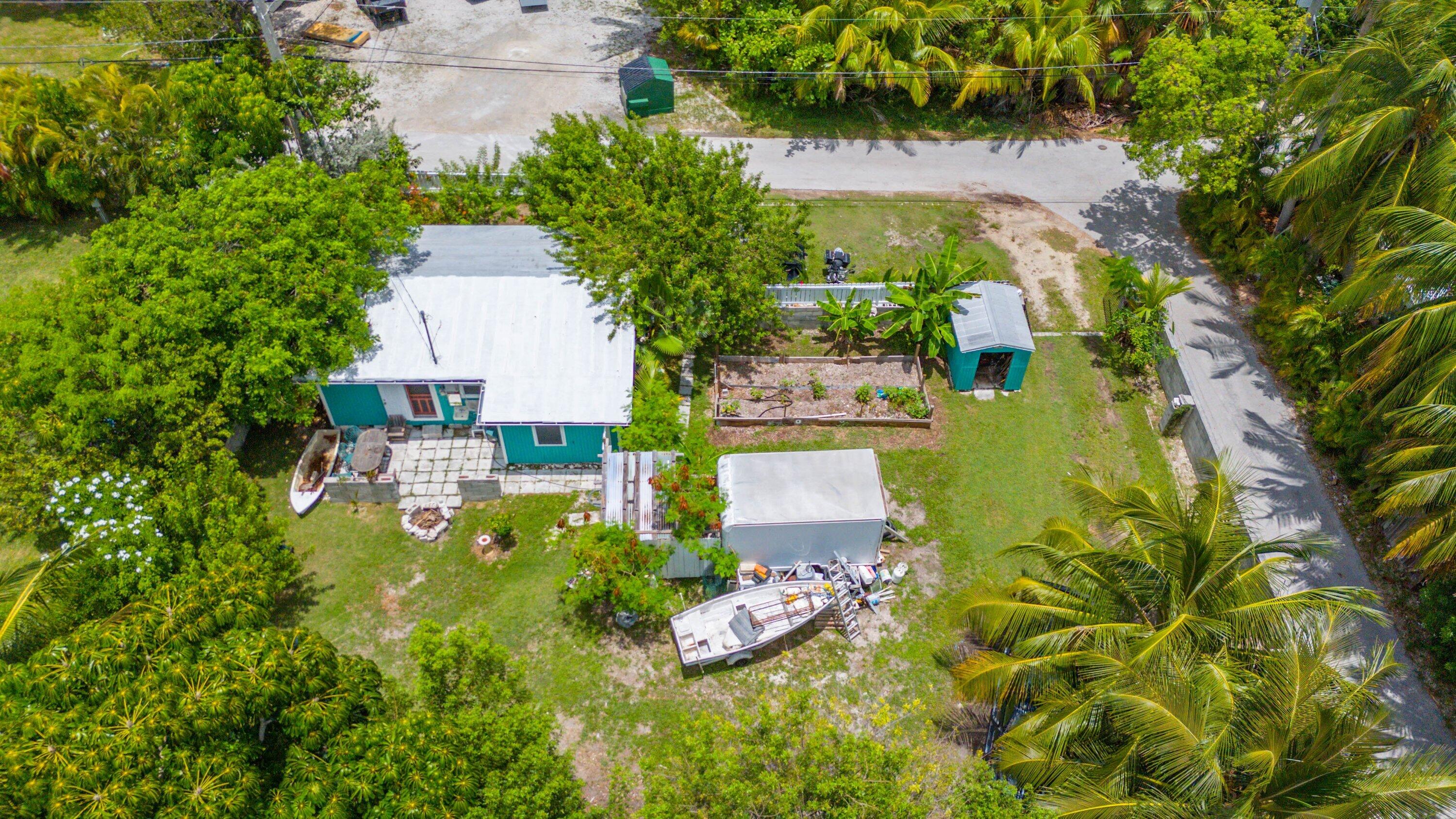 19910 Flamingo Road Sugarloaf, FL 33042 - Photo 22 of 26 an aerial view of a house with swimming pool and garden