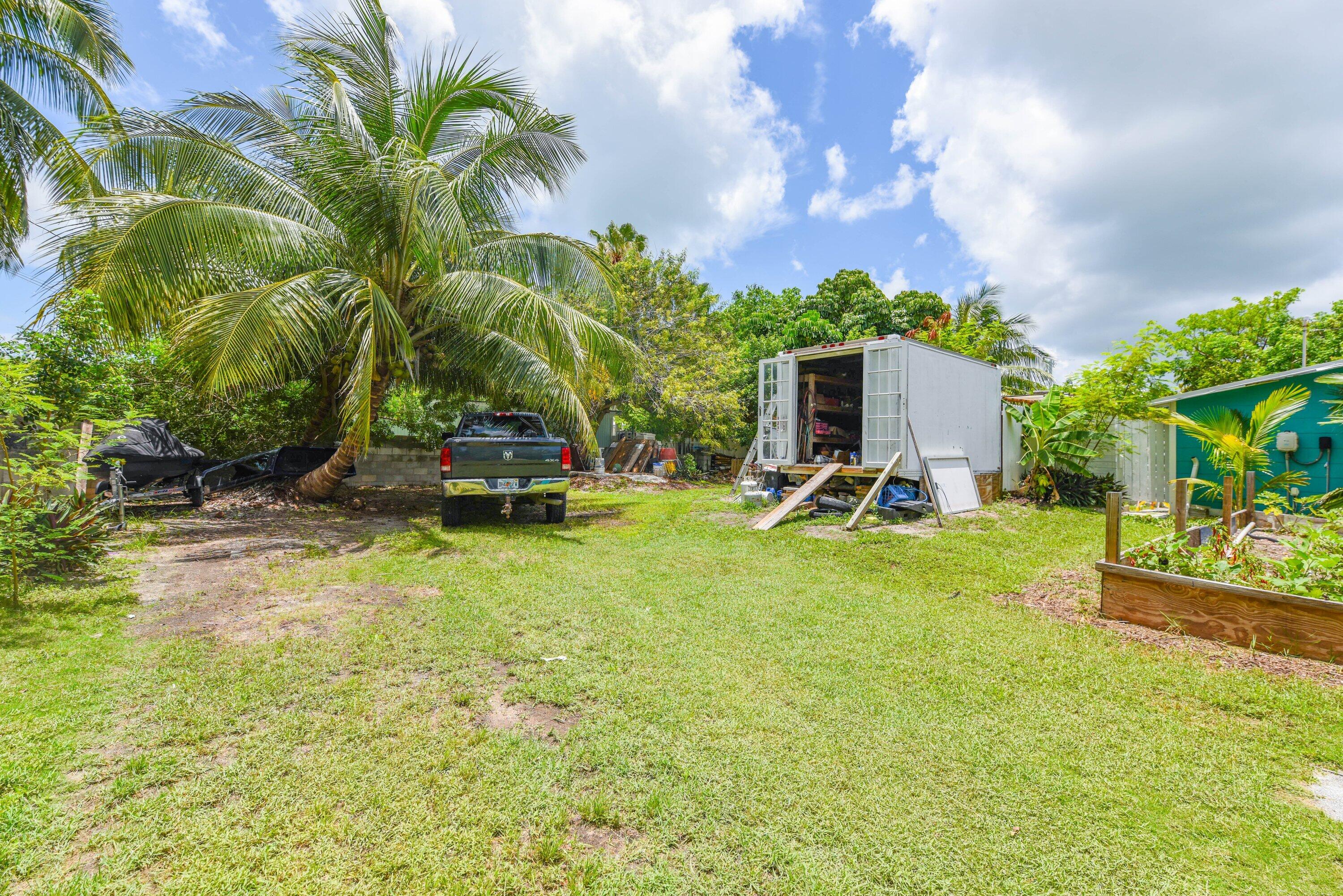 19910 Flamingo Road Sugarloaf, FL 33042 - Photo 24 of 26 a view of a backyard with a garden and plants