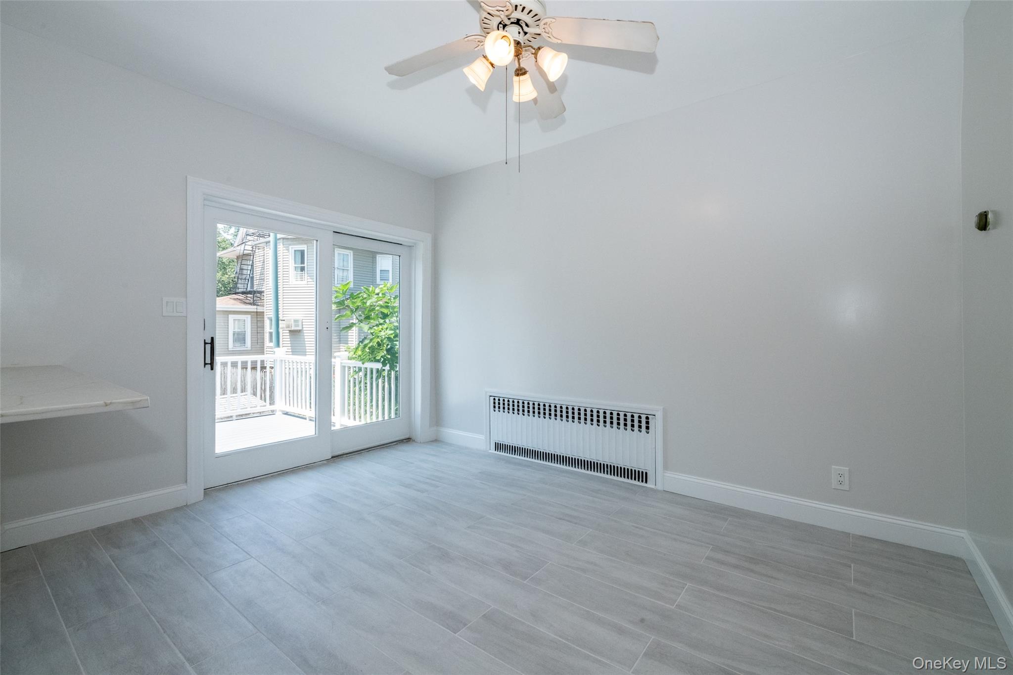 7 Alpha Place, Unit FIRST New Rochelle, NY 10805 - Photo 3 of 25 Dining area with sliding door to back deck.