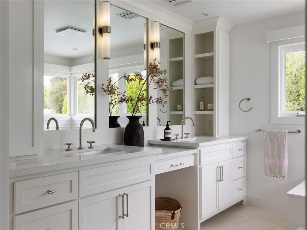 1120 Dolphin Terrace Corona del Mar, CA 92625 - Photo 12 of 48 a bathroom with a sink double vanity and a mirror