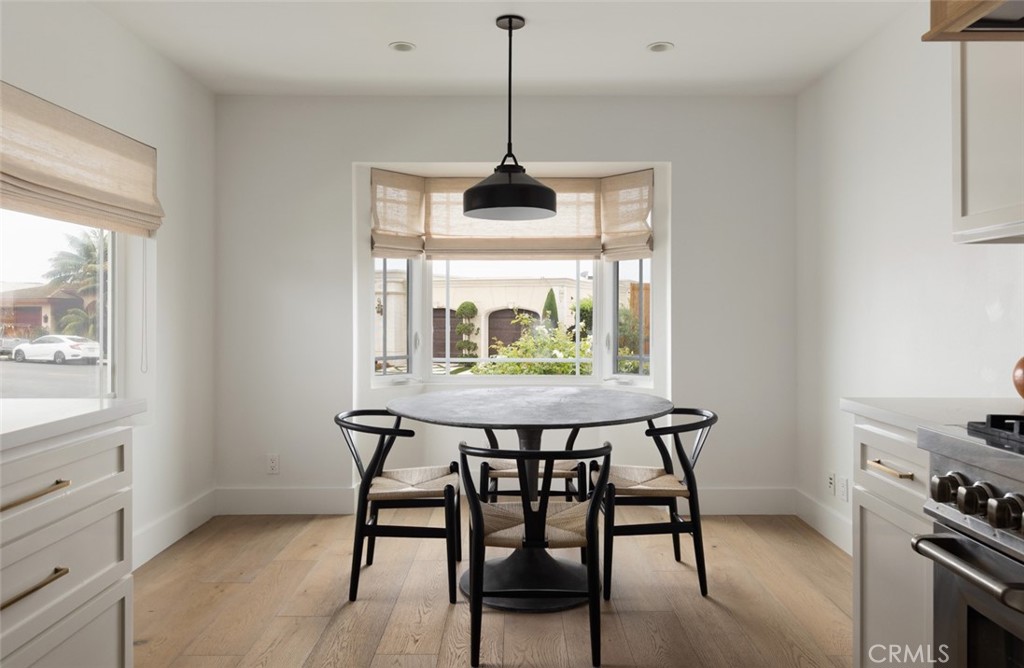 1120 Dolphin Terrace Corona del Mar, CA 92625 - Photo 16 of 48 a dining room with a table and chairs