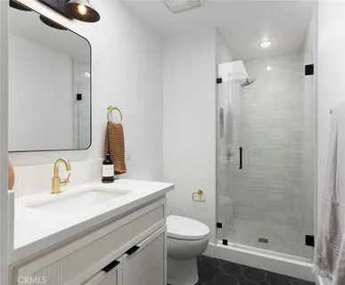 a living room with furniture a mirror and a large window