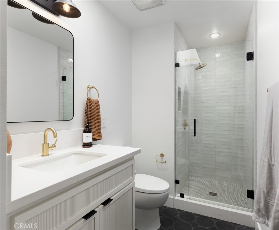 1120 Dolphin Terrace Corona del Mar, CA 92625 - Photo 21 of 48 a bathroom with a sink a toilet and shower