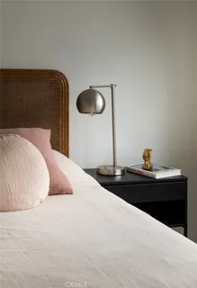 a kitchen with white cabinets and window