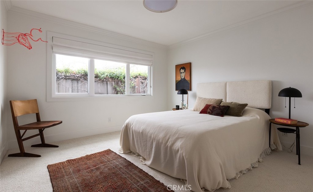 1120 Dolphin Terrace Corona del Mar, CA 92625 - Photo 25 of 48 a bedroom with a bed chair and window