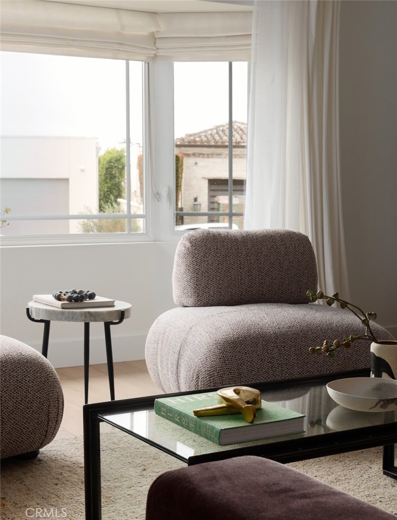 1120 Dolphin Terrace Corona del Mar, CA 92625 - Photo 28 of 48 a bedroom with a bed and a couch next to a window