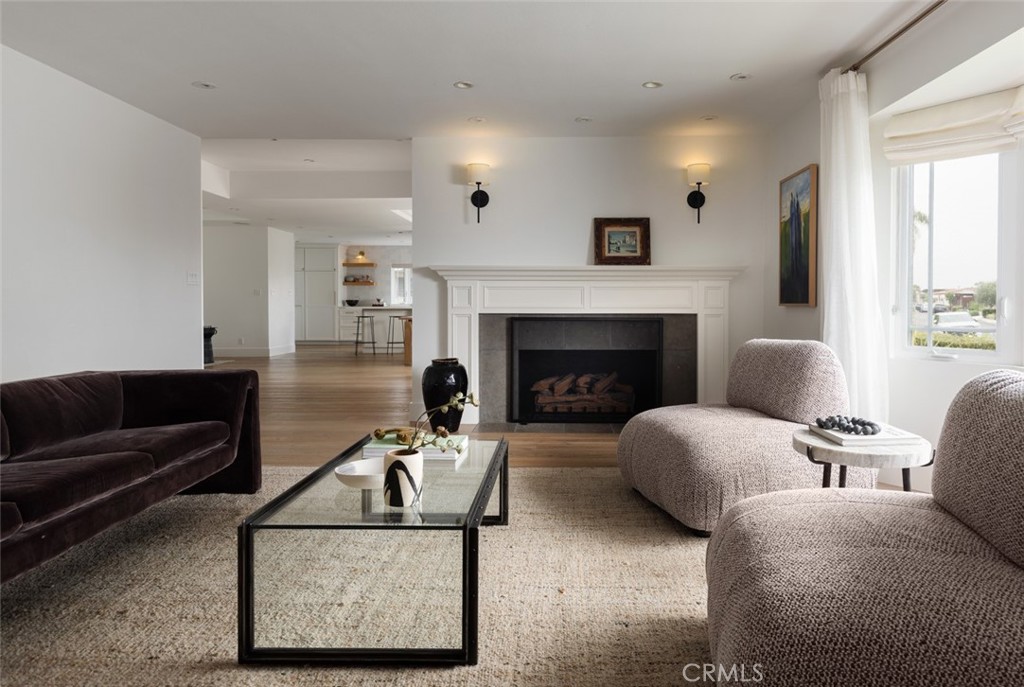 1120 Dolphin Terrace Corona del Mar, CA 92625 - Photo 31 of 48 a living room with furniture and a fireplace