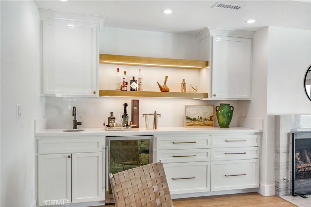1120 Dolphin Terrace Corona del Mar, CA 92625 - Photo 34 of 48 a kitchen with white cabinets and window