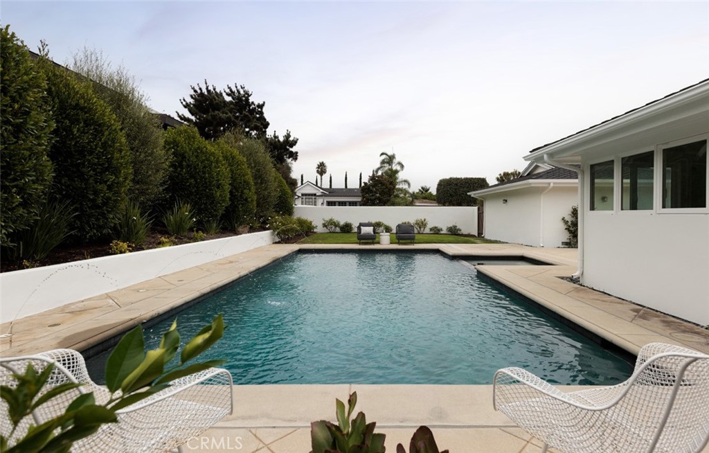 1120 Dolphin Terrace Corona del Mar, CA 92625 - Photo 44 of 48 a view of a swimming pool with a patio