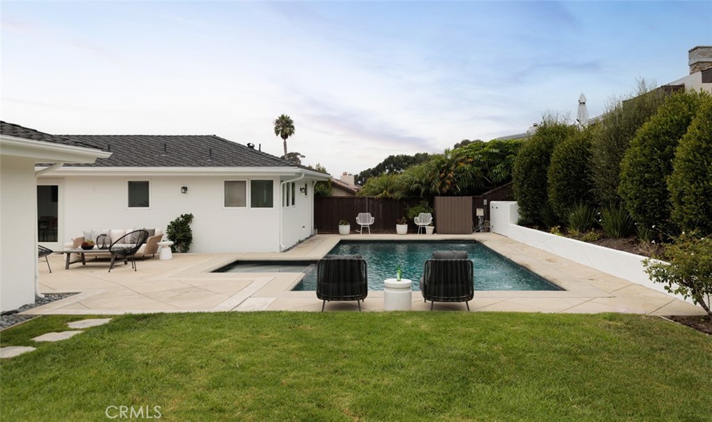 1120 Dolphin Terrace Corona del Mar, CA 92625 - Photo 6 of 48 a view of a house with backyard and sitting area