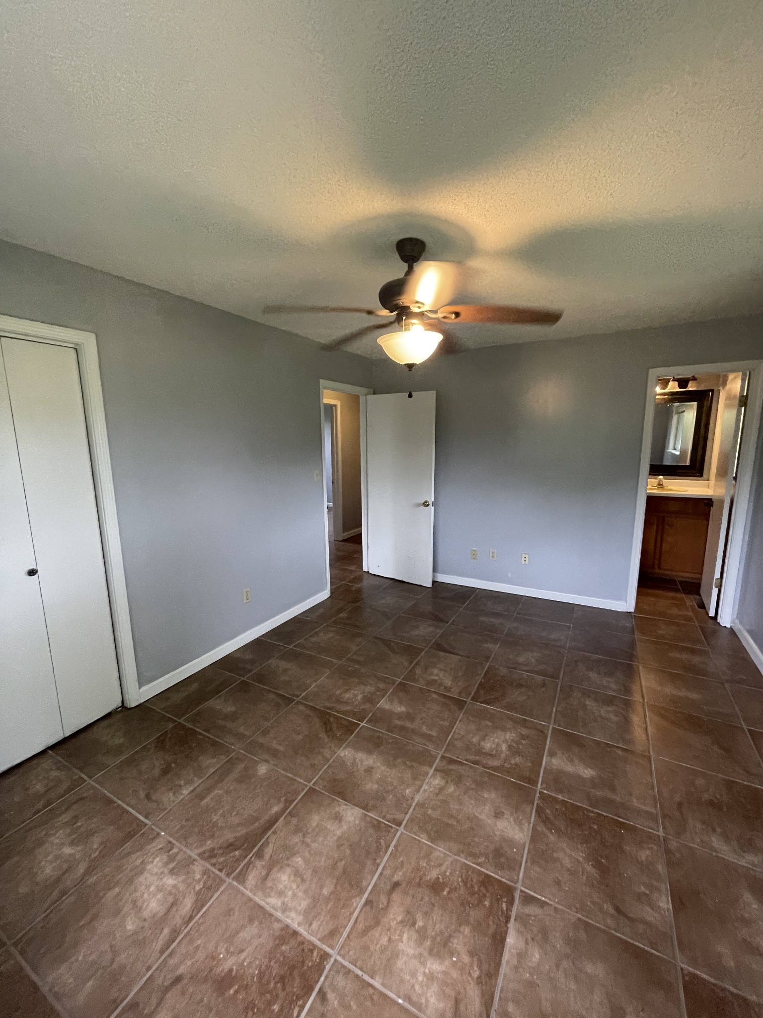 178 Lester Plunk Road Bethel Springs, TN 38315 - Photo 13 of 39 a view of an empty room and a chandelier fan