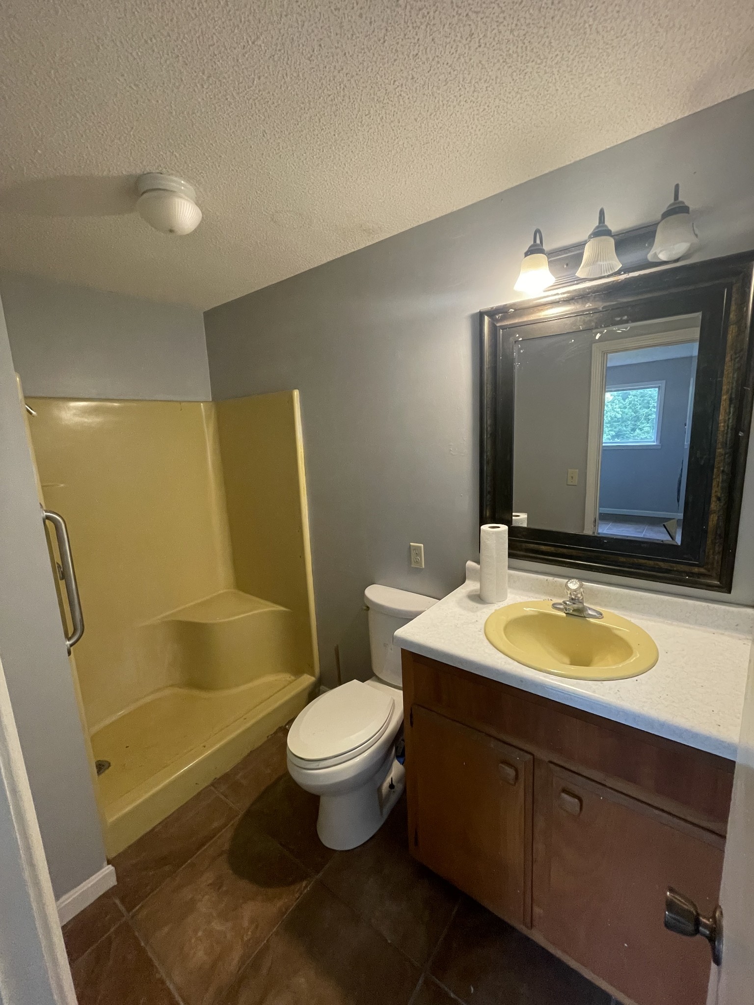 178 Lester Plunk Road Bethel Springs, TN 38315 - Photo 14 of 39 a bathroom with a toilet sink and mirror
