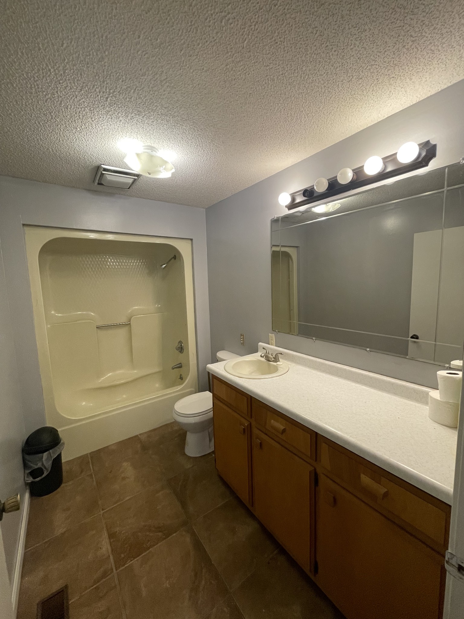 178 Lester Plunk Road Bethel Springs, TN 38315 - Photo 17 of 39 a bathroom with a double vanity sink a toilet and mirror