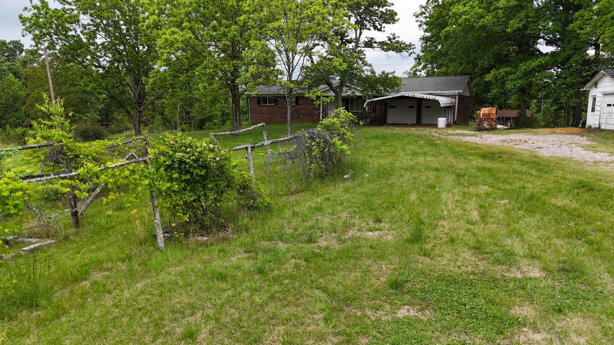 178 Lester Plunk Road Bethel Springs, TN 38315 - Photo 3 of 39 a view of house with trees in front of it