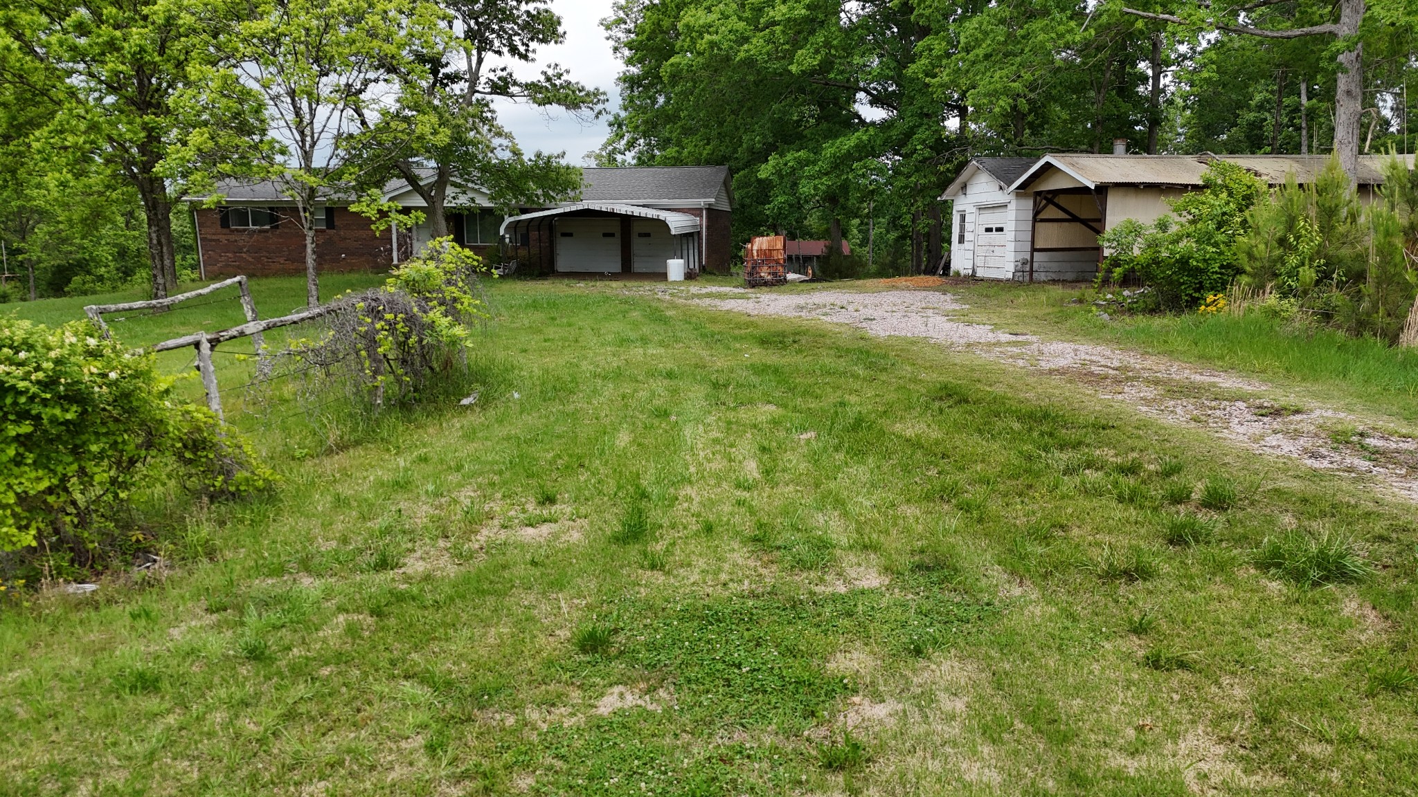 178 Lester Plunk Road Bethel Springs, TN 38315 - Photo 4 of 39 a view of a house with backyard and garden