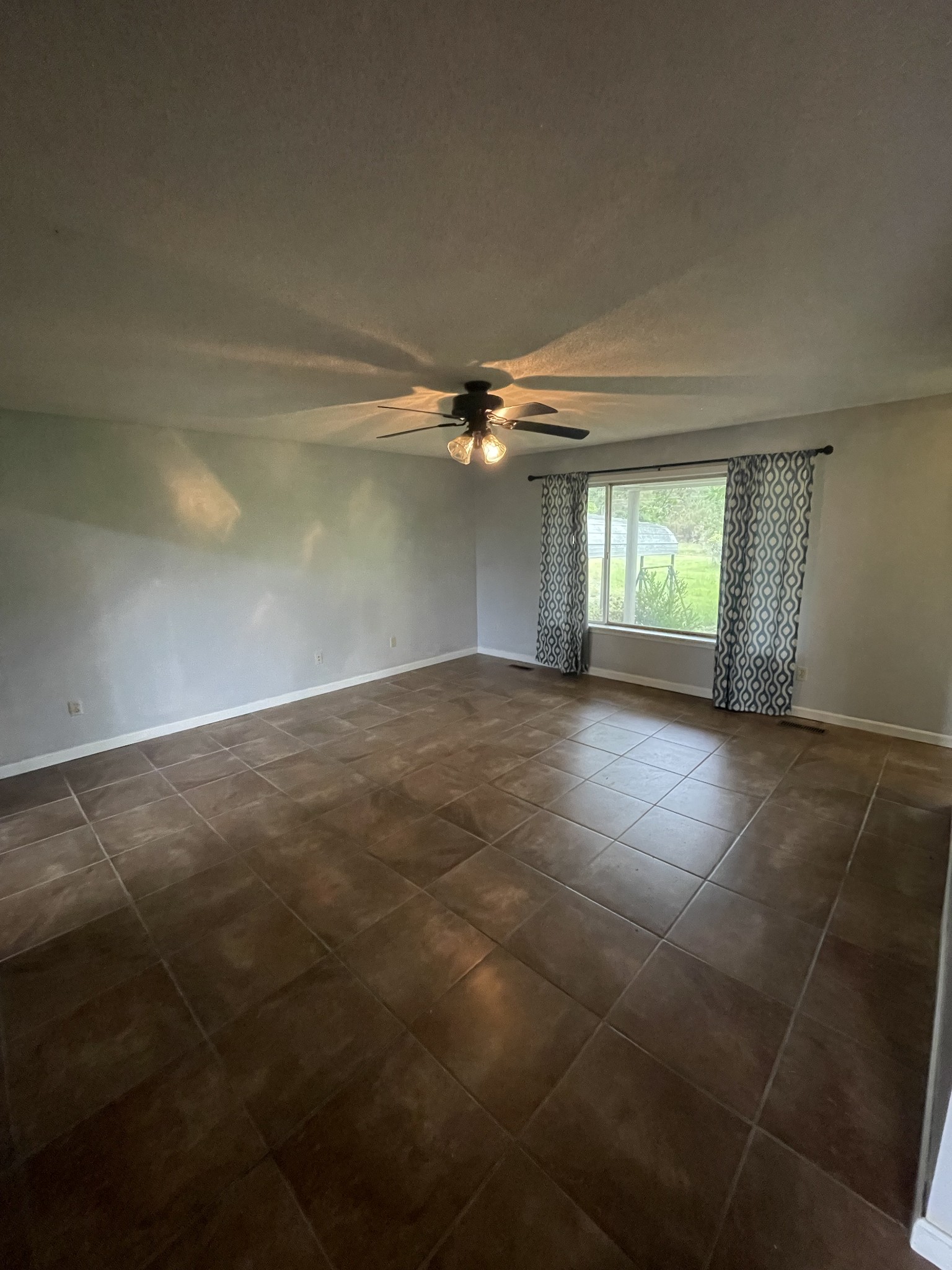 178 Lester Plunk Road Bethel Springs, TN 38315 - Photo 8 of 39 an empty room with a empty space and windows