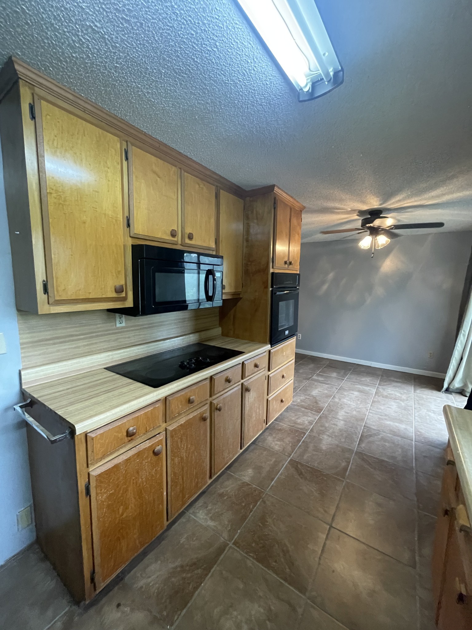 178 Lester Plunk Road Bethel Springs, TN 38315 - Photo 10 of 39 a kitchen with stainless steel appliances a sink a stove a microwave and cabinets