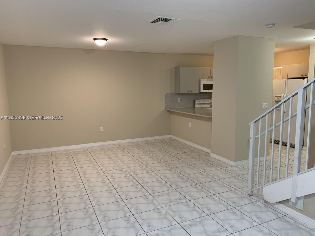 6761 Northwest 182nd Street, Unit 104 Hialeah, FL 33015 - Photo 1 of 12 a view of a kitchen with a sink and cabinets