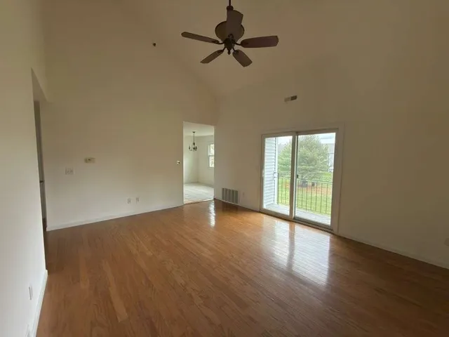 a kitchen with stainless steel appliances granite countertop a sink a stove top oven a counter space and cabinets