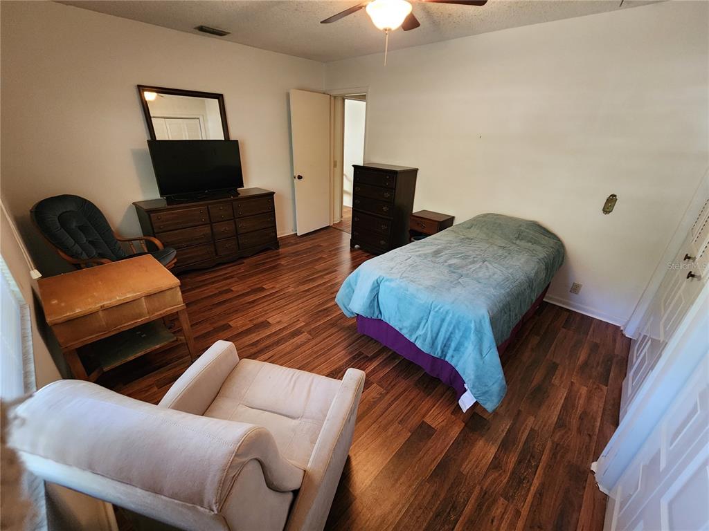 108 Lameraux Road Winter Haven, FL 33884 - Photo 13 of 27 a living room with furniture and a flat screen tv