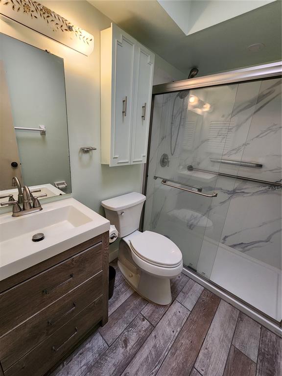 108 Lameraux Road Winter Haven, FL 33884 - Photo 17 of 27 a bathroom with a sink mirror vanity and toilet