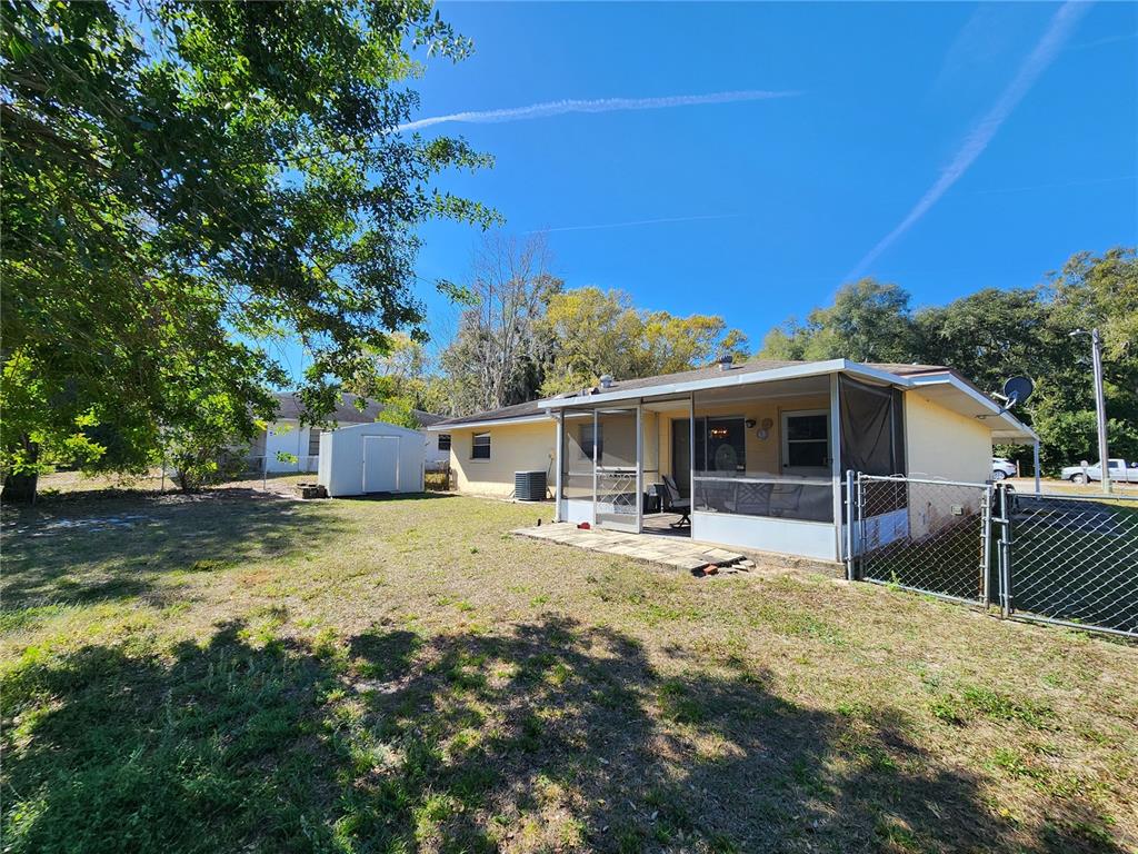 108 Lameraux Road Winter Haven, FL 33884 - Photo 18 of 27 a swimming pool with wooden fence