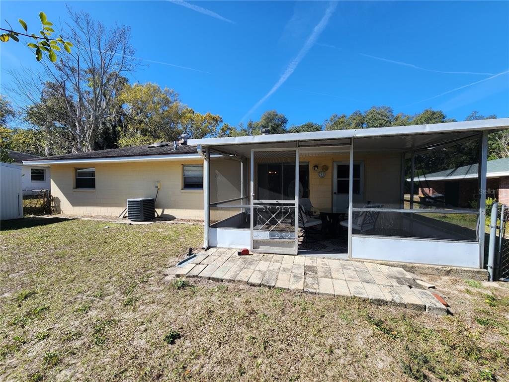 108 Lameraux Road Winter Haven, FL 33884 - Photo 20 of 27 a view of a house with wooden floor and potted plants
