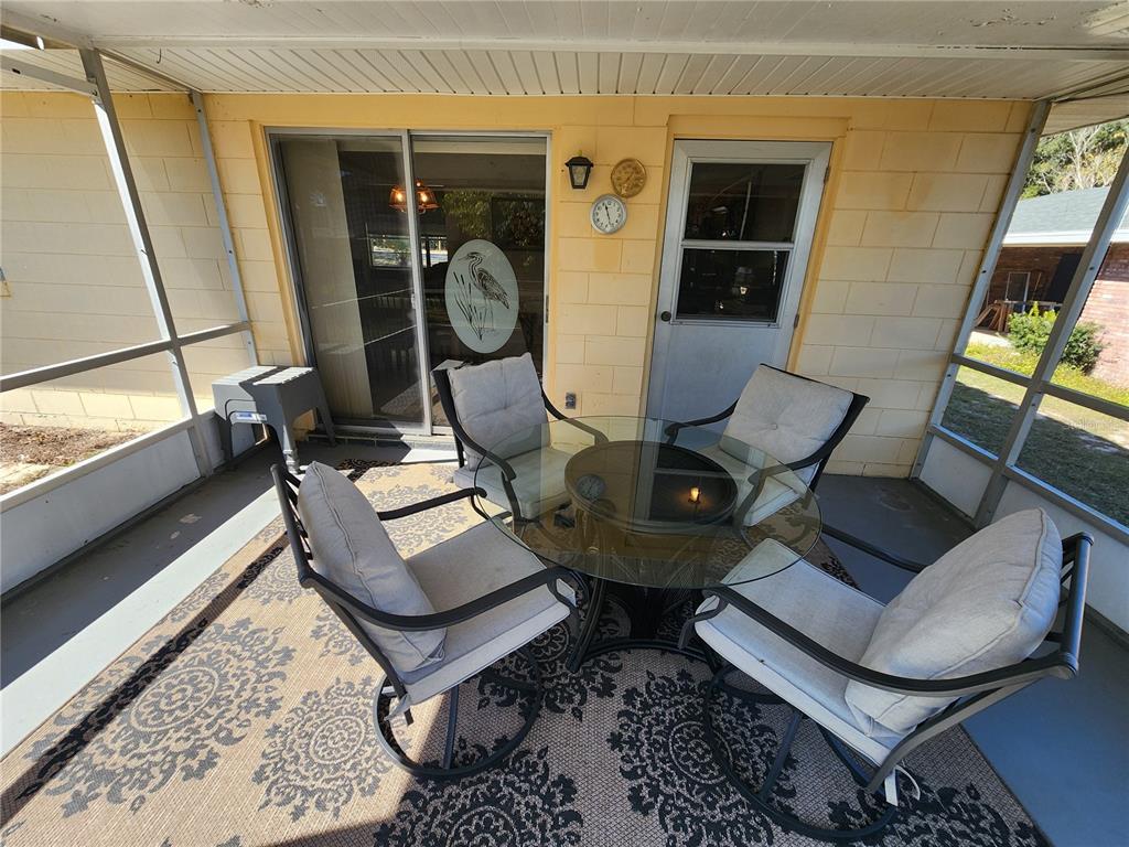108 Lameraux Road Winter Haven, FL 33884 - Photo 22 of 27 a living room with furniture and a window
