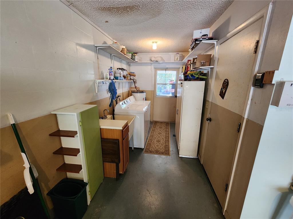 108 Lameraux Road Winter Haven, FL 33884 - Photo 25 of 27 a view of a storage & utility room with stuff