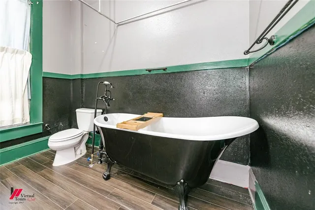 a bathroom with a sink a toilet a mirror and vanity