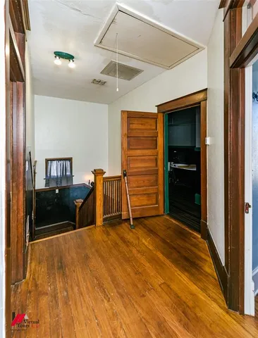 a view of a livingroom with furniture and an empty room
