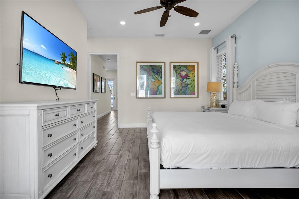 2972 Salted Rim Road Kissimmee, FL 34747 - Photo 15 of 39 a bedroom with a bed and a flat screen tv