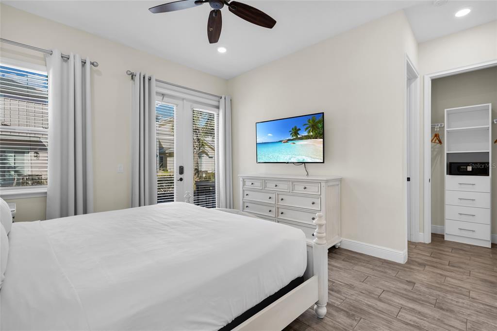2972 Salted Rim Road Kissimmee, FL 34747 - Photo 16 of 39 a bedroom with a bed and a flat screen tv