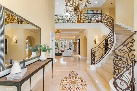 a living room with a large window and furniture