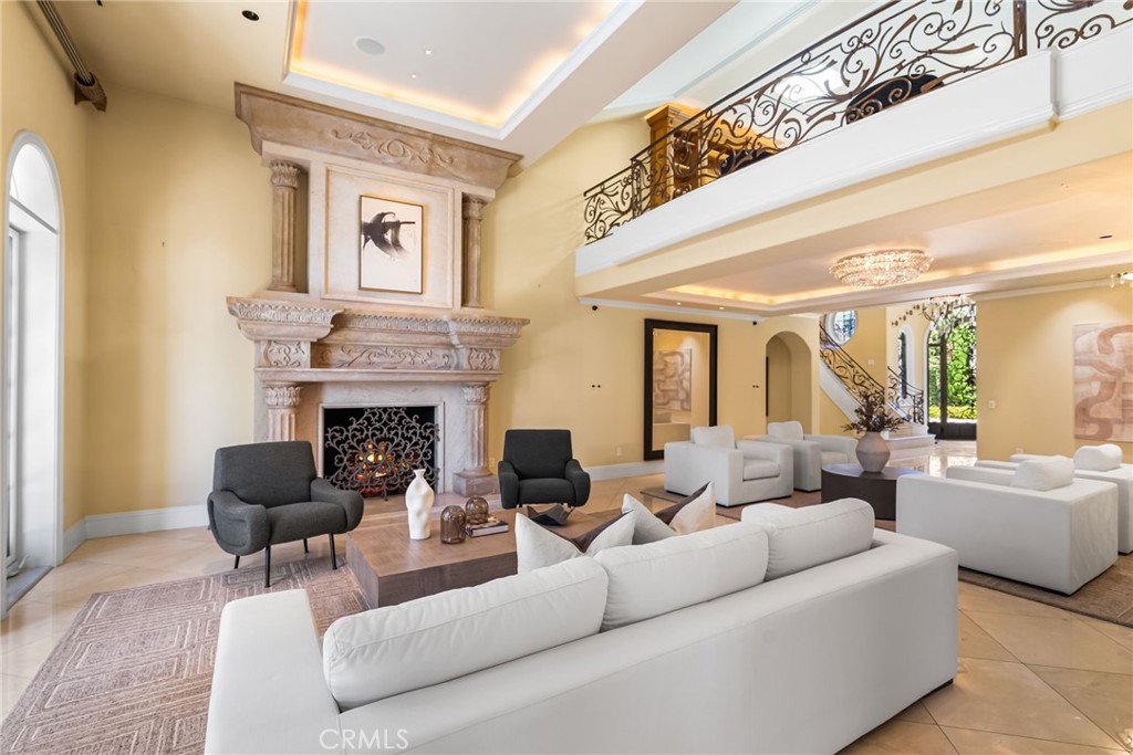 26501 Silver Saddle Lane Laguna Hills, CA 92653 - Photo 18 of 59 a living room with furniture a fireplace and a large window