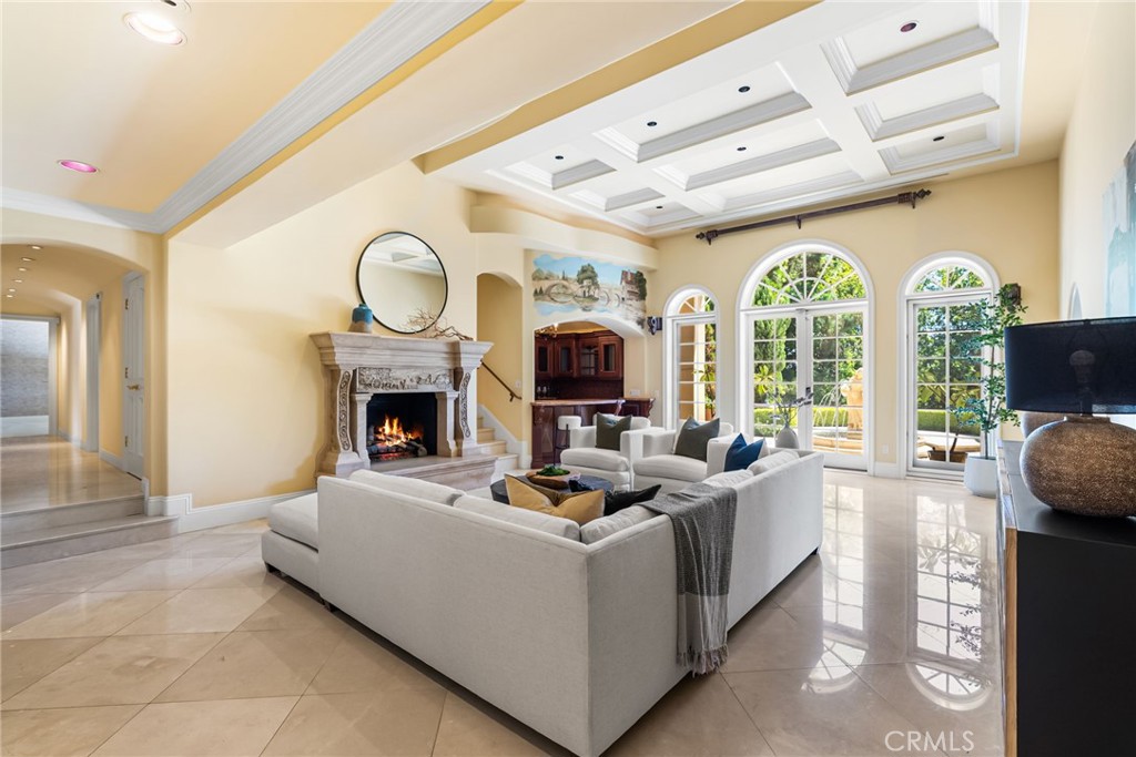 26501 Silver Saddle Lane Laguna Hills, CA 92653 - Photo 26 of 59 a living room with furniture a fireplace and a large window