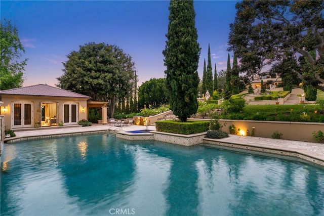 a view of swimming pool with outdoor seating