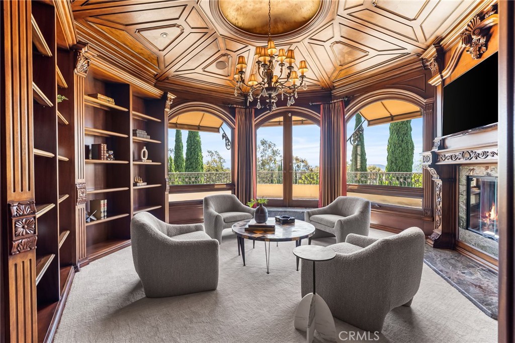 26501 Silver Saddle Lane Laguna Hills, CA 92653 - Photo 33 of 59 a living room with fireplace furniture and a flat screen tv